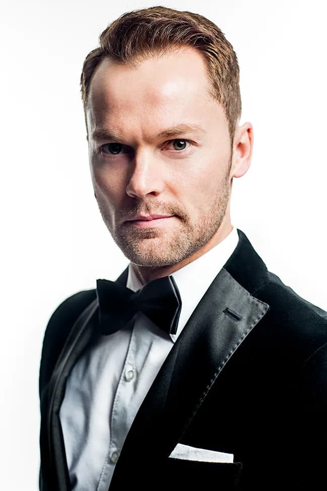 Travis Tuft headshot in black tie